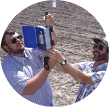 Agricultural engineers Bradley King (left, of the University of Idaho, and Dennis Kincaid, with the ARS Northwest Irrigation and Soils Research Laboratory at Kimberly, attach a variable-flow sprinkler head to an irrigation system